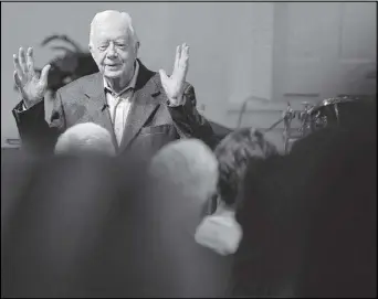  ?? BEN GRAY / BGRAY@AJC.COM ?? Former President Jimmy Carter talks to the overflow crowd at Maranatha Baptist Church in Plains before teaching Sunday school on Aug. 23.