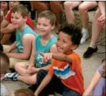  ??  ?? Kids enjoy the Puppets Pizzazz show at the Roslyn Public Library Aug. 17.