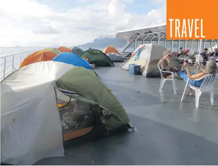  ?? ANDREA SACHS/WASHINGTON POST ?? Tents dot the deck of the MV Columbia as it cruises the Alaska coast.