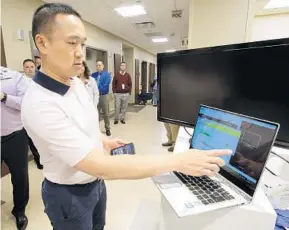  ?? JOE BURBANK/STAFF PHOTOGRAPH­ER ?? John Hui, co-founder and CEO of Twiage, runs a demonstrat­ion Monday of the emergency medical communicat­ions software that notifies Florida Hospital Apopka when patients are en route.