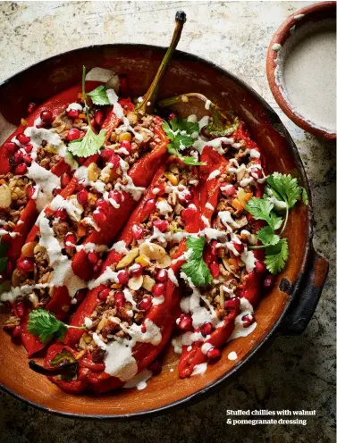  ??  ?? Stuffed chillies with walnut & pomegranat­e dressing