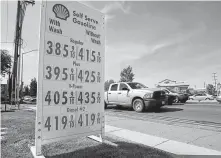  ?? Associated Press file photo ?? Gas prices are shown in Sacramento, Calif., in April. The state has said it would use its powers to set tougher mileage standards than Washington has proposed.