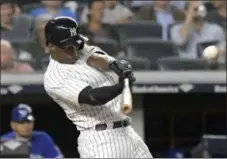  ?? BILL KOSTROUN - THE ASSOCIATED PRESS ?? FILE - In this Sept. 14, 2018, file photo, New York Yankees’ Andrew McCutchen hits a home run during the fifth inning of a baseball game against the Toronto Blue Jays, at Yankee Stadium in New York.