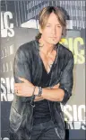  ?? CP PHOTO ?? Keith Urban arrives at the CMT Music Awards at Music City Center on June 7 in Nashville, Tenn.