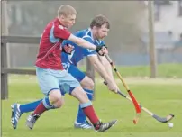  ??  ?? Lewis Douglas, Strathglas­s, gets his block in on Kilmallie’s Ian Robertson.