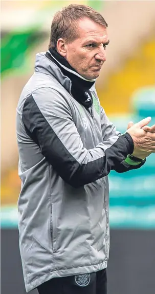  ??  ?? Celtic manager Brendan Rodgers watches training in Glasgow yesterday.