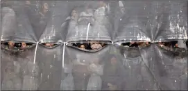  ?? ?? Ultra-Orthodox Jewish women are seen behind a curtain Thursday during the ceremony.