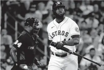  ?? Karen Warren/Staff photograph­er ?? Yordan Alvarez, one of the few Astros who has been hitting well lately, expresses his displeasur­e after striking out against Marlins reliever Steven Okert in the eighth inning Saturday.