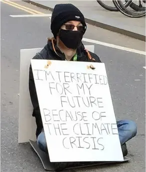  ?? Pic: Extinction Rebellion ?? CJ, a 19-year-old student, during his protest