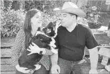  ?? CRAIG KOHLRUSS TNS ?? Conrad "Tyler" DiFalco-Jimenez gets a kiss from Zippy the dog with help from his fiancee Morgan Cansler while spending time at Tyler's uncle's ranch.