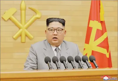  ?? AP PHOTO ?? In this photo provided by the North Korean government, North Korean leader Kim Jong Un delivers his New Year’s speech at an undisclose­d place in North Korea Monday.