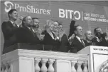  ?? RICHARD DREW/AP ?? PROSHARES CEO MICHAEL
SAPIR, second right, and company Global Investment Strategist Simeon Hyman, right, lead the New York Stock Exchange opening bell celebratio­n Tuesday.