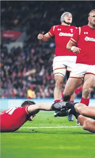  ??  ?? Israel Dagg scores for the All Blacks against Wales last night.