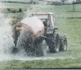  ?? ?? A farmer sprays his field