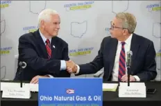  ?? Jeff Dean/Associated Press ?? Former Vice President Mike Pence greets Ohio Gov. Mike DeWine at the start of the Gas Energy Education Program roundtable discussion Thursday in Cincinnati.