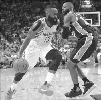  ?? GEORGE BRIDGES/THE ASSOCIATED PRESS ?? Rockets guard James Harden drives against San Antonio Spurs forward Jonathon Simmons on Saturday at Houston. Harden had a triple-double with 25 points, 13 assists and 11 rebounds, but the Rockets lost 106-100.