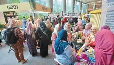  ?? — raja FAISAL hishan/the Star ?? Time to mingle: delegates visiting booths during a break at the Bumiputra Economic congress 2024 in Putrajaya yesterday.