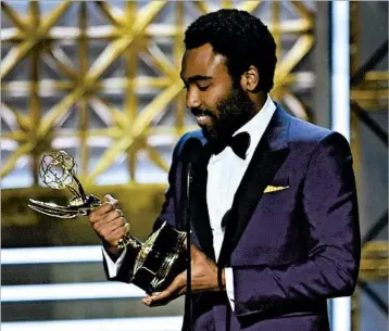  ?? FREDERIC J. BROWNGETTY-AFP ?? Donald Glover of “Atlanta” became the first African-American to win an Emmy for directing a comedy.