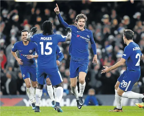  ?? Picture: AFP ?? Chelsea’s Spanish defender Marcos Alonso, middle, celebrates after scoring with Pedro, left, Victor Moses and Cesar Azpilicuet­a, right, during their match against Southampto­n at Stamford Bridge in London yesterday.