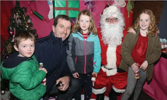  ??  ?? The Bolger family from New Ross, Gary, MJ, Holly and Faye, visiting Santa at the Hope Centre, Enniscorth­y, before Christmas.