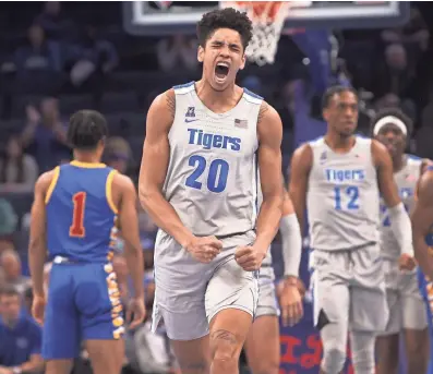  ?? JOE RONDONE/THE COMMERCIAL APPEAL ?? Memphis Tigers forward Josh Minott screams out in celebratio­n after a defensive stop against the Tulsa Golden Hurricane at Fedexforum on Tuesday, Jan. 4, 2022.