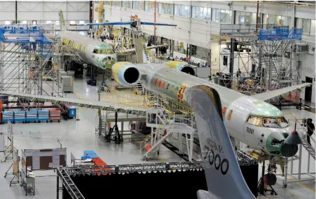  ?? CP FILE PHOTO ?? People tour the Bombardier facility in Toronto on Nov. 3, 2015. U.S. Internatio­nal Trade Commission­ers voted unanimousl­y that Bombardier’s C Series aircraft doesn’t harm Boeing Co.’s business.