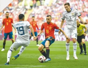  ??  ?? Frustrated...Spain’s Jordi Alba can find no way through against Russia