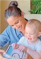  ??  ?? Meghan Markle reading to baby Archie on his first birthday.