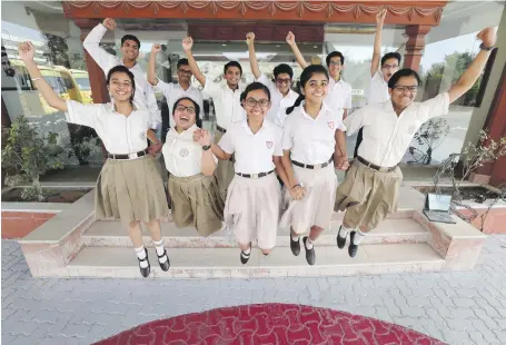  ?? Chris Whiteoak / The National ?? Pupils at Indian High School, Dubai, celebrate their CBSE Grade 10 results, now reflected as a percentage
