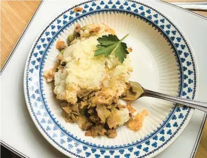  ?? GRETCHEN MCKAY/PITTSBURGH POST-GAZETTE ?? Cottage pie features beef, peas and mashed potatoes.