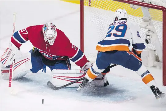  ?? GRAHAM HUGHES/THE CANADIAN PRESS ?? Canadiens goaltender Antti Niemi stops New York Islanders forward Brock Nelson during the first period Wednesday night at the Bell Centre.