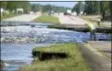  ?? MATT BORN /THE STAR-NEWS VIA AP ?? Flooding from Sutton Lake has washed away part of U.S. 421 in New Hanover County just south of the Pender County line in Wilmington, N.C., Friday.