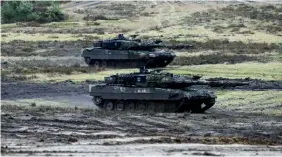  ?? BLOOMBERG ?? The German army showcasing Leopard 2 A6 battle tanks, destined for Ukraine. With Russia’s invasion of Ukraine adding to a world hit by multiple woes, the term “polycrisis” came into being