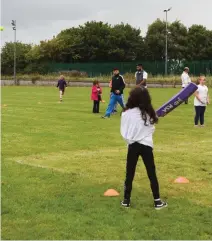 ??  ?? Children in Cranmore try their hand at cricket!