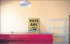  ??  ?? Kameraden: The one-stop shop is bare, but South African Communist Party members jolly it up when they drop off more ANC election pamphlets