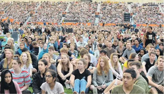  ?? PHOTOS: GERARD O’BRIEN ?? A crowd estimated at 18,000 packed into Forsyth Barr Stadium for last night’s civic vigil in Dunedin, burning candles, taking a moment to reflect and drawing strength from each other.