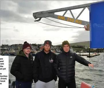  ?? Photos by Declan Malone ?? RIGHT: Local fishermen Liam Flannery, Adam Flannery and Tom Brosnan beside the crane that has been installed on the quayside in Dingle, but is not yet available for use.BELOW: Sinn Féin TD Martin Ferris and Sinn Féin local election candidate Robert Brosnan (front) with party supporters and local fishermen on Dingle pier on Sunday.