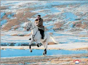  ?? AP/Korean Central News Agency ?? North Korean leader Kim Jong Un rides a white horse, a symbol of the Kim family, to climb Mount Paektu near his country’s border with China in this undated photo provided Wednesday.