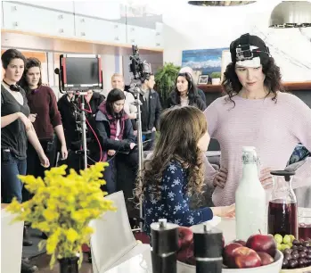  ??  ?? Sam Spear, far left, and her twin sister Kailey watch the filming of a scene of their short film CC, with Audrey Wise Alveraz and Jewel Staite, right. The film is among the six finalists in the Crazy8s Film Society competitio­n.