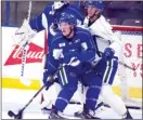  ?? DAVID CROMPTON/Penticton Herald ?? Right-winger Brock Boeser, a 2015 firstround pick of the Vancouver Canucks, battles for position in front of the net during Thursday’s practice at the SOEC.