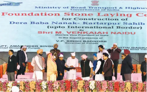  ?? AKHILESH KUMAR ?? VICE PRESIDENT M. VENKAIAH NAIDU pressing the remote button to lay the foundation stone for the Kartarpur corridor on the Indian side while Punjab Chief Minister Amarinder Singh looks on, in Gurdaspur on November 26.