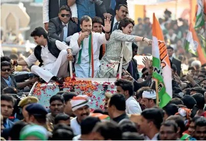  ?? PTI ?? Rahul Gandhi with Priyanka Gandhi Vadra and Jyotiradit­ya Madhavrao Scindia during the roadshow in Lucknow on Monday. —
