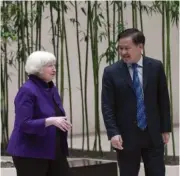  ?? AP PHOTO/TATAN SYUFLANA ?? U.S. Treasury Secretary Janet Yellen, left, talks with Governor of the People’s Bank of China Pan Gongsheng as they meet Monday at the People’s Bank of China in Beijing.
