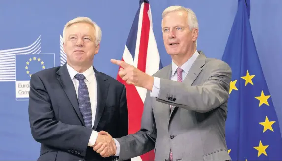  ??  ?? > Downintg Street insists talks between Brexit Secretary David Davis, left, and the EU’s chief negotiator Michel Barnier, right, have made important progress