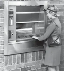  ?? NCR VIA THE ASSOCIATED PRESS ?? A woman uses an automated teller machine in this photo from the 1970s. This year marks the 50th anniversar­y of the ATM.