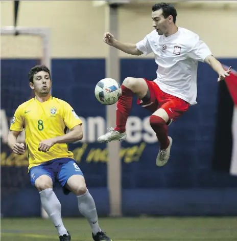  ?? MICHELLE BERG ?? Poland’s Bobbi Nicholat and Brazil’s Pedro Bianchi fight for control of the ball at the Saskatoon World Cup championsh­ip final at SaskTel Sports Centre last May in Saskatoon. Defending champion Brazil is set to meet Portugal, Canada and Cameroon in...