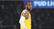  ?? Mark J. Terrill / Associated Press ?? LeBron James says he won’t wear one of the NBA-approved social justice messages on the back of his jersey when the NBA resumes competitio­n later this month.