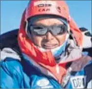  ??  ?? Lakba Sherpa on the summit of Ama Dablam in Nepal