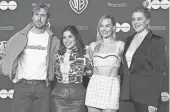  ?? IMAGES BRIDGET BENNETT/AFP VIA GETTY ?? From left, “Barbie” stars Ryan Gosling, America Ferrera and Margot Robbie with screenwrit­er/ director Greta Gerwig.