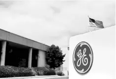  ??  ?? The logo of General Electric is shown at their subsidiary company GE Aviation in Santa Ana, California. Caterpilla­r Inc, United Technologi­es Corp, Dana Inc, 3M Co and General Electric Co, are offshoring work to Mexico, China, India and other countries,...